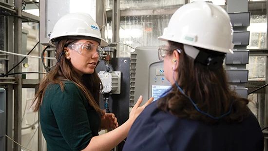 Women standing by power grid - Ecolab workforce development